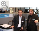 AMITEC 2010 in Leipzig Gerhard Wolf ist im Vertrieb der MAHA Group (li.), Claus Dienelt vertreibt das E.A.R.S. Druckluftsystem.   