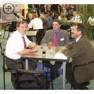 Hofmann Werkstatt-Technik auf der REIFEN 2004 in Essen. Besuch aus Gnzburg. Erich Kraft und Stefan Meternek von Reifen Ihle im Gesprch mit Armin Langenmair (von links). Hofmann 